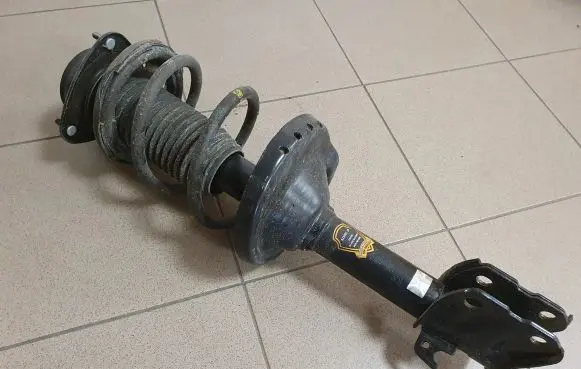 Subaru Outback Front shock absorber with coil spring