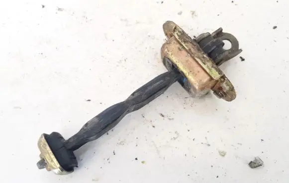 Front door check strap stopper