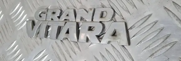 Suzuki Grand Vitara I Manufacturers badge/model letters 