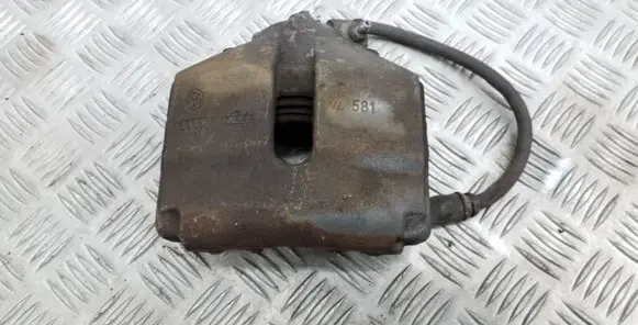 Volkswagen PASSAT B7 Front brake caliper 581