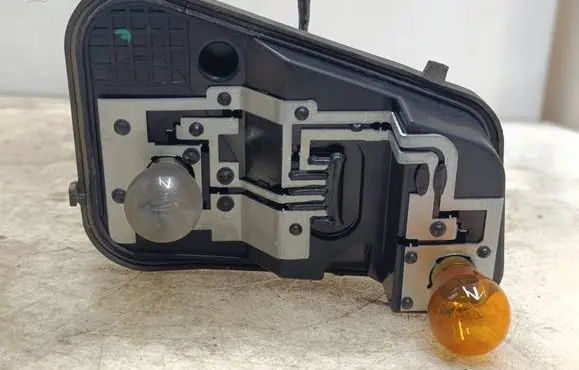 Volkswagen Touareg I Tail light bulb cover holder 7L6945257