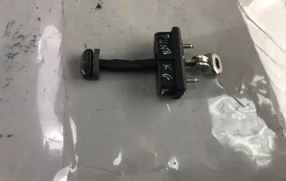 Rear door check strap stopper