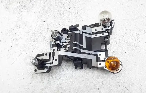 Tail light bulb cover holder