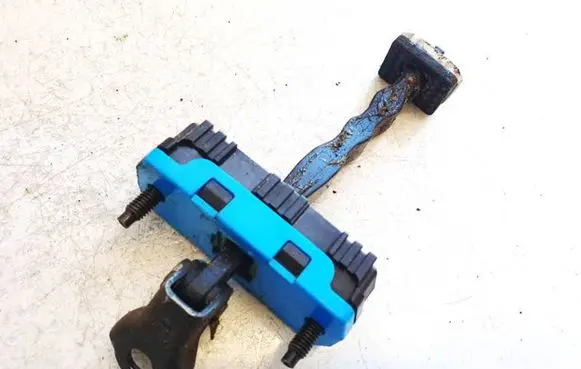Front door check strap stopper