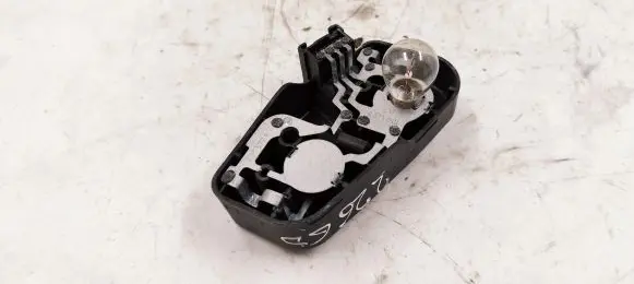 Tail light bulb cover holder