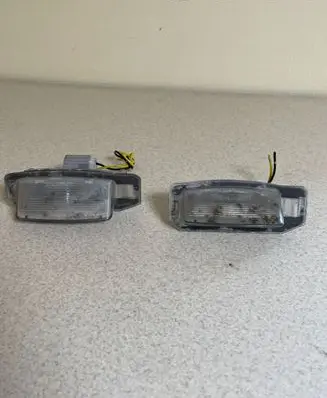Mitsubishi Outlander Number plate light E130653 141283 04D0T