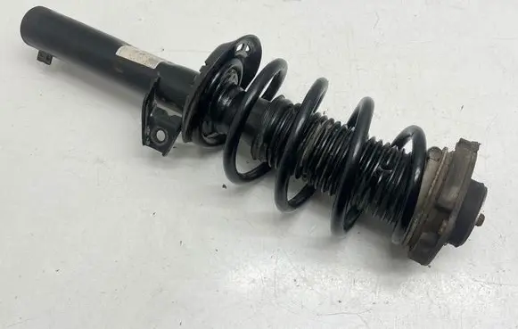 Volkswagen Caddy Front shock absorber with coil spring 317575 824904013020