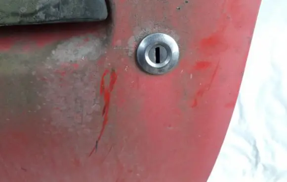 Mazda 121 Front door lock (next to the handle) 