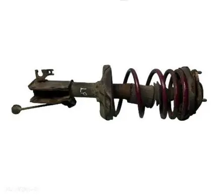 Mazda 323 F Front shock absorber with coil spring