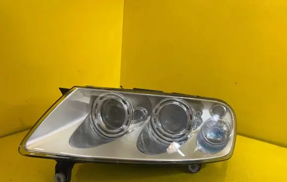 Volkswagen Touareg I Headlight/headlamp 69307859