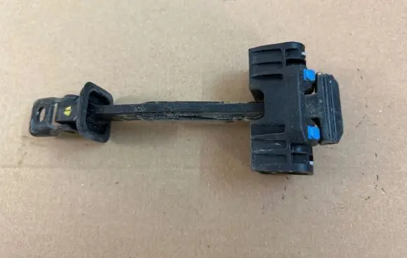 Rear door check strap stopper