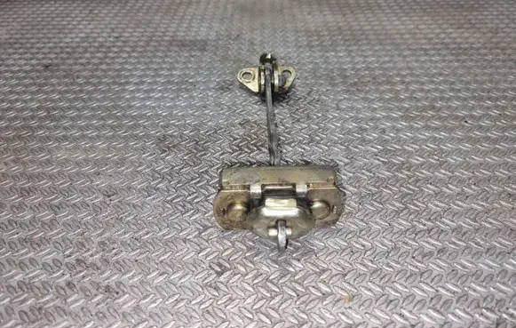Front door check strap stopper