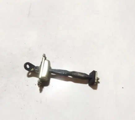 Front door check strap stopper