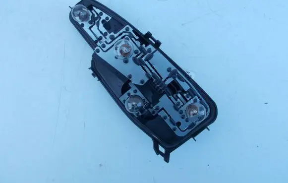 Tail light bulb cover holder