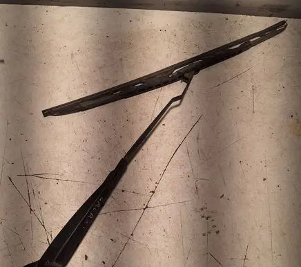 Front wiper blade arm