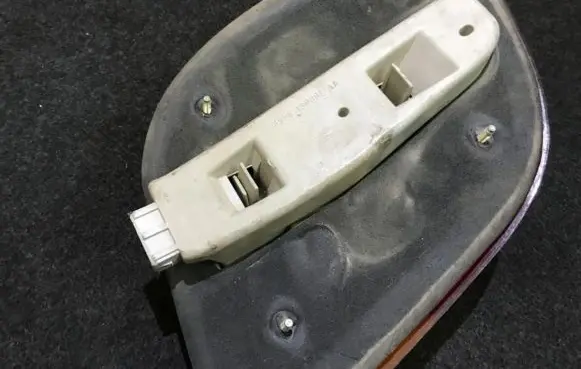 Tail light bulb cover holder