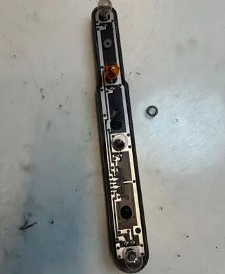Tail light bulb cover holder