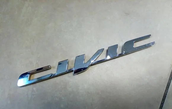Honda Civic IX Manufacturers badge/model letters NE69714