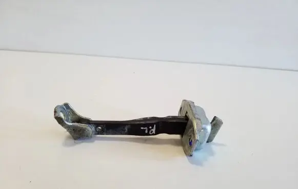 Front door check strap stopper