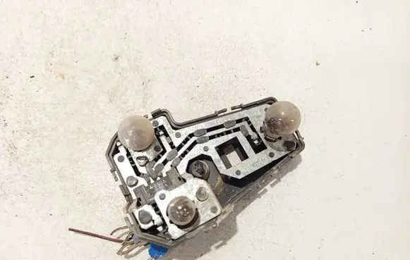 Tail light bulb cover holder