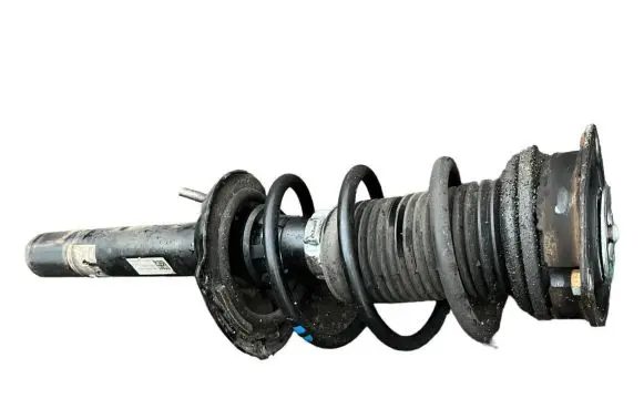 Volkswagen Golf VII Front shock absorber with coil spring 5Q0413023FJ