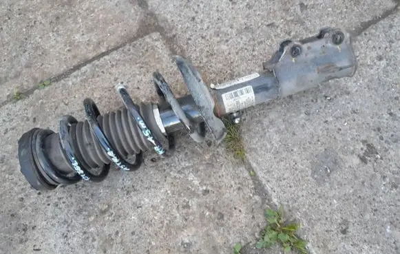 Opel Astra J Front shock absorber with coil spring 13412613 2114 422267257