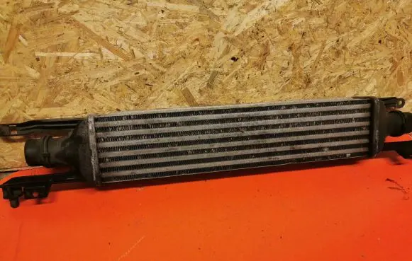 Opel Corsa D Intercooler radiator 55702194