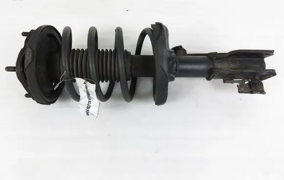 Mazda 323 F Front shock absorber with coil spring