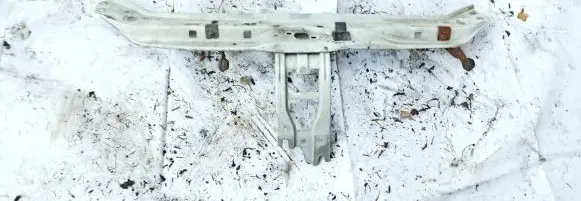Radiator support slam panel