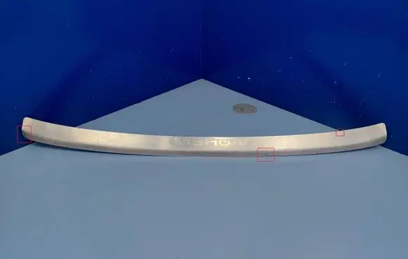Rear bumper trim bar molding