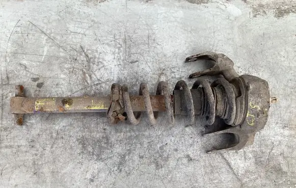 Cadillac CTS Front shock absorber with coil spring 25700259