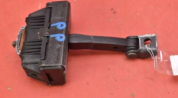Front door check strap stopper