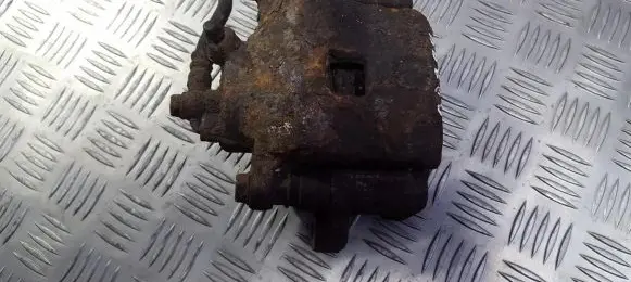 Mazda 323 F Front brake caliper