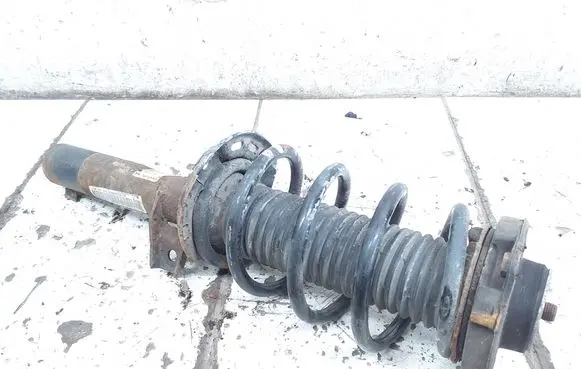 Volkswagen Golf V Front shock absorber with coil spring 1T0413031HA