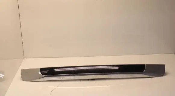 Trunk door license plate light bar