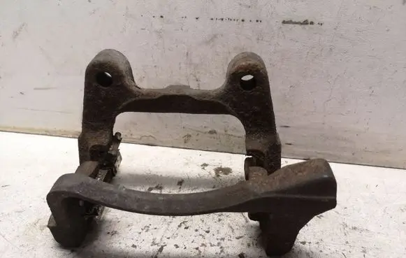 Volkswagen PASSAT B7 Brake caliper pad carrier rear 0107A