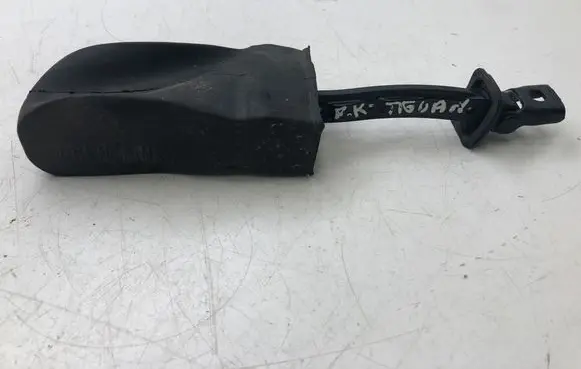 Front door check strap stopper