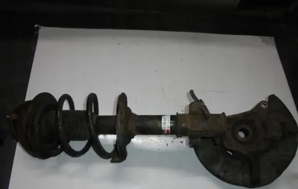 Subaru Impreza III Front shock absorber with coil spring 20310FG180