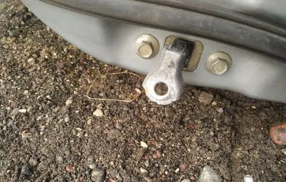 Front door check strap stopper