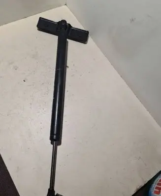 Front door check strap stopper