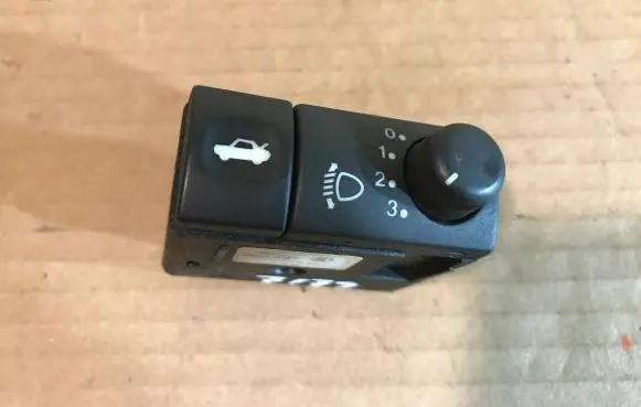 Headlight level height control switch