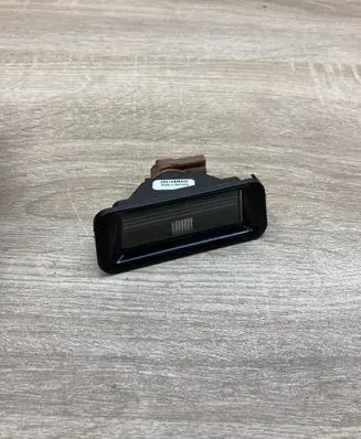 Nissan Almera Tino Number plate light 26515BM400 LEFTSIDE