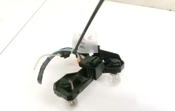 Tail light bulb cover holder