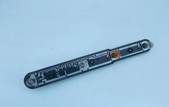 Tail light bulb cover holder