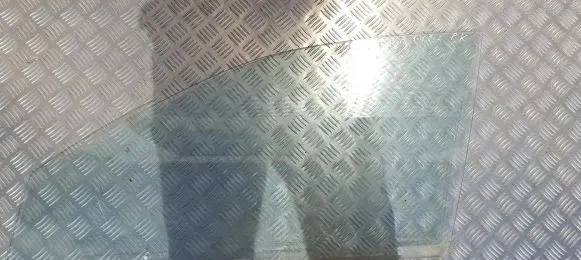 Mazda 323 Front door window glass four-door