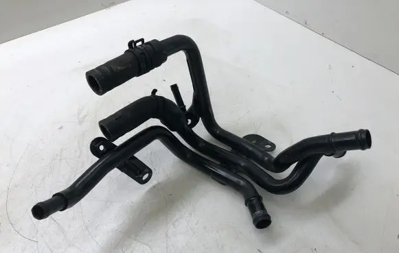 Volkswagen Golf VII Engine coolant pipe/hose 04L121064AD