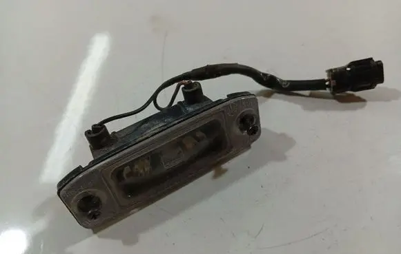 KIA Carens II Number plate light