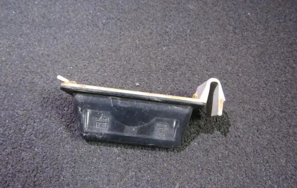 Mazda 323 Number plate light 8245