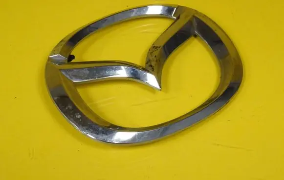 Mazda Demio Manufacturer badge logo/emblem D26751730