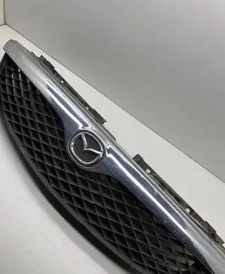 Mazda 626 Front bumper upper radiator grill